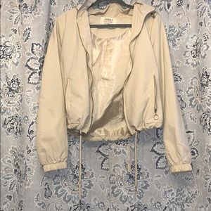 Will fit a petite Small. With gold detail